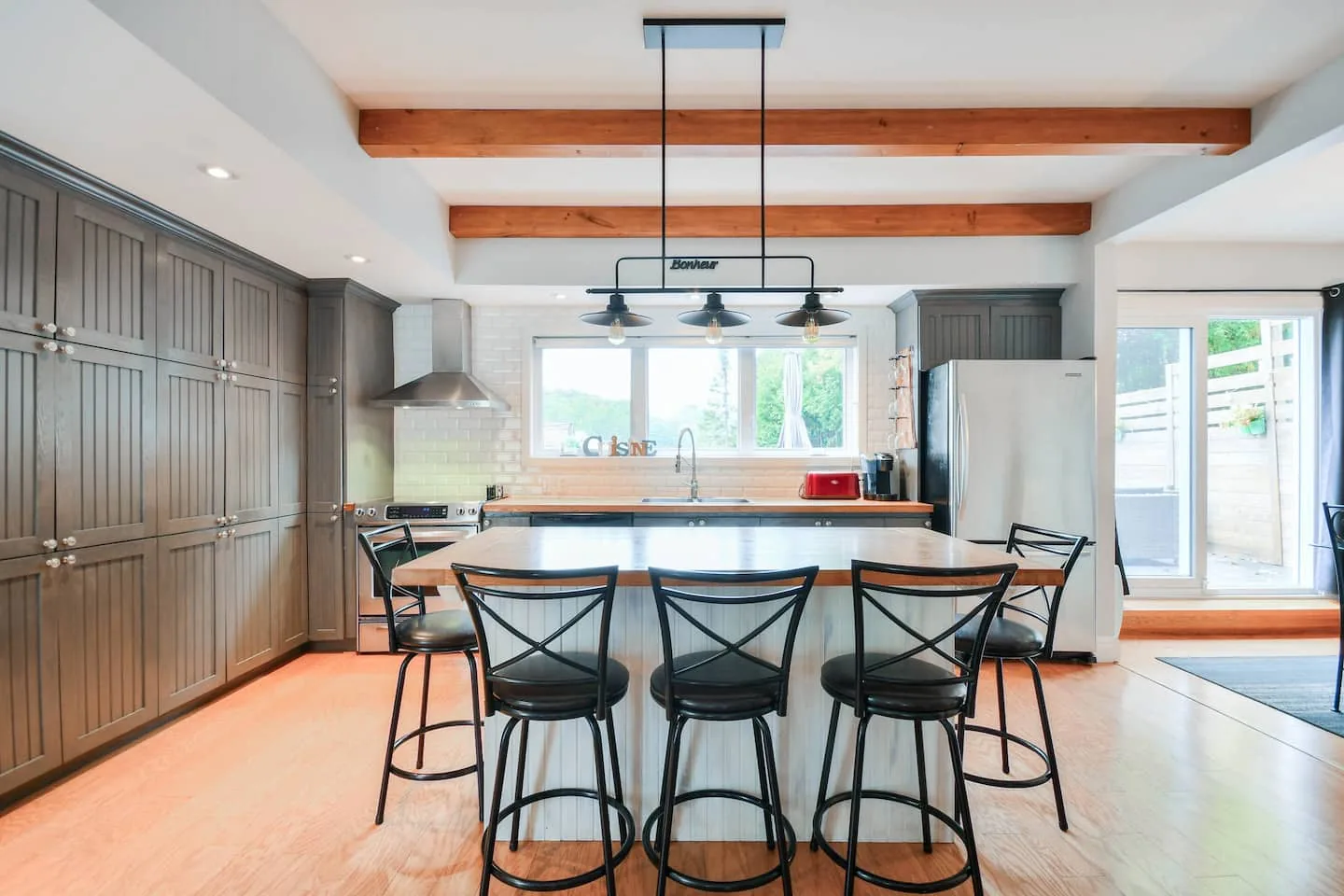 The fully equipped kitchen and island