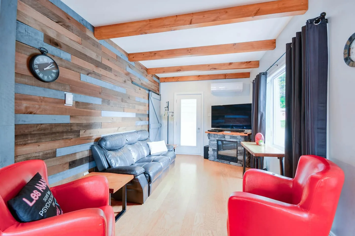 The living room with its barnwood wall